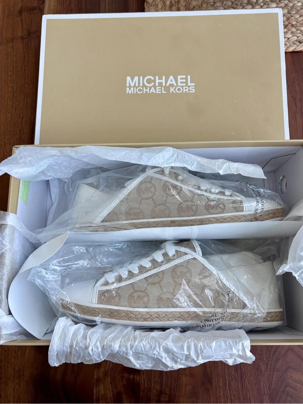 Brand New pair of Michael Kors Kristy Slide Sneakers in a cream and beige, 6.5.